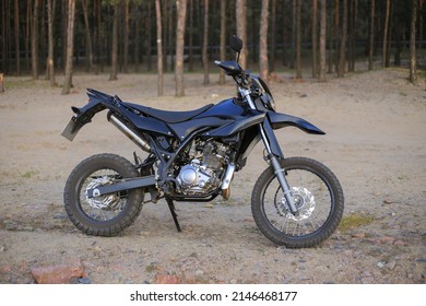 Black motorcycle motard on the nature