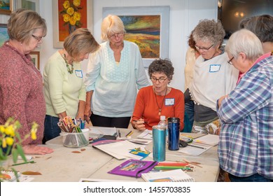 Black Mountain, NC / USA - June 14, 2019: A Group Of Older Woman Listen To Instruction From The Instructor During An Adult Art Class.