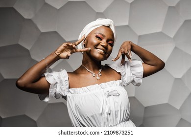 Black Muslim Woman Holding Up 2 Fingers Have Party. African Girl Is Celebrating Her Birthday And Having Fun.