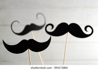Black mustache on wooden stick, closeup - Powered by Shutterstock