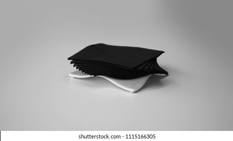 Black Napkins On White Napkin Holder