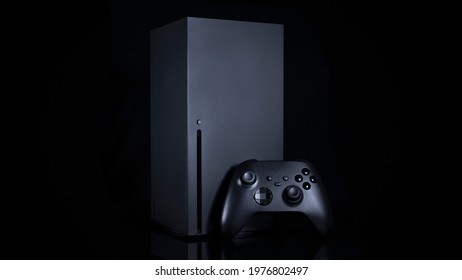 Black Next Generation console and controller.