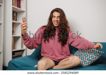 Similar – Image, Stock Photo Cheerful non-binary person dancing on the street in the city