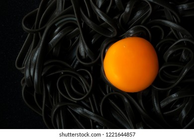 black noodles with egg yolk