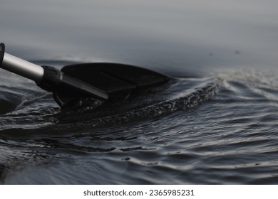 black oar in water rowing closeup - Powered by Shutterstock