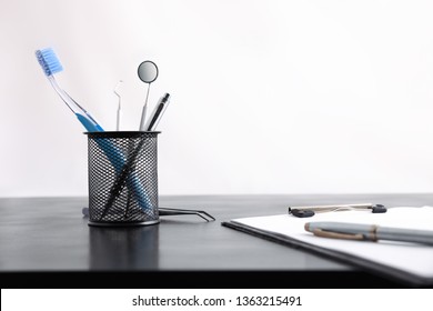 Black Office Desk Of A Dentist With Office And Dental Supplies Isolated. Front View. Horizontal Composition.