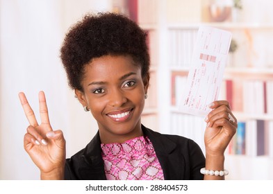 Black Office Woman Holding Up Ticket And Doing A Peace Sign With Other Hand Concept Transport Airplane Airline Bus Train Traveling Airport Counter Depart Flight