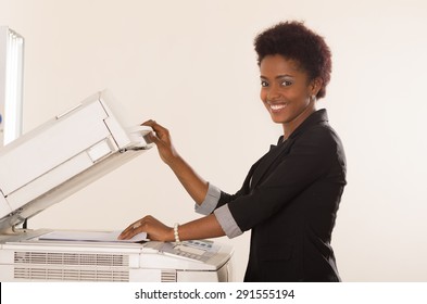 Black Office Woman Paper In Copy Machine And Holding Lid Up