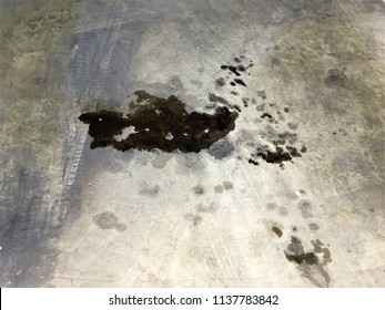 Black Oil Stains On The Floor Car Garage. Abstract Design For Industry Background.