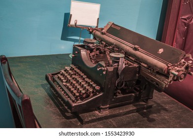Black old typewriter on the table