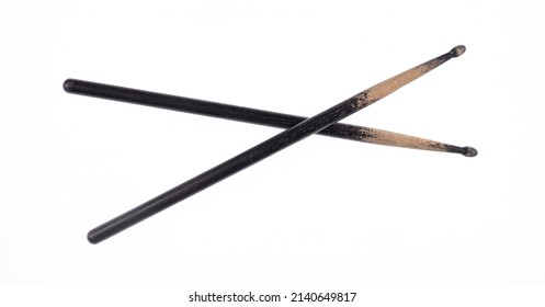 black old wooden drumsticks isolated on white background