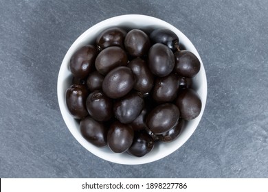 Black Olives From Above Bowl On A Slate Top View