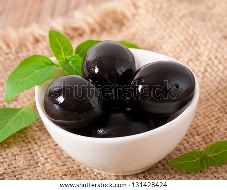Black olives on a wooden table Stock photo © 