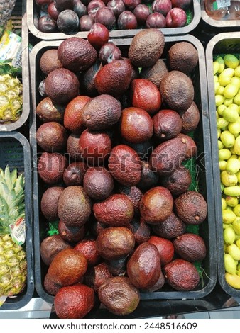 black organic avocados fruit group stock 