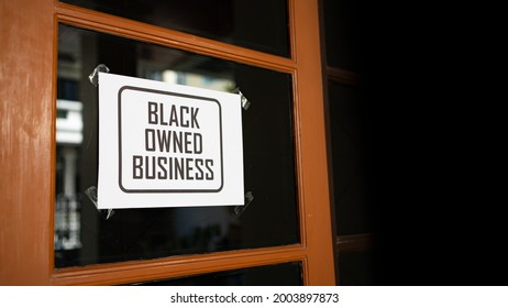 Black Owned Business Sign Were Attached On The Window