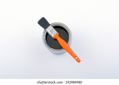 Black Paint Can And Brush On White Background