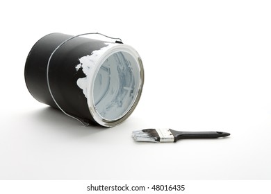 A Black Paint Can And Paintbrush