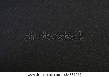 Black paper background. Blank black paper sheet.