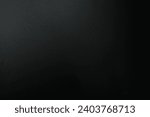 Black paper background with light for adding letters.