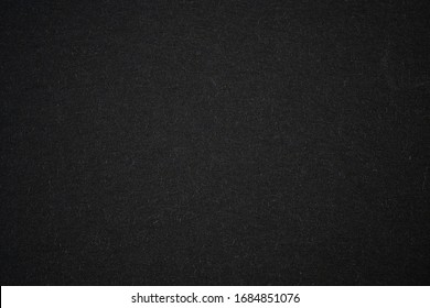 Black paper background with radial gradient vignette