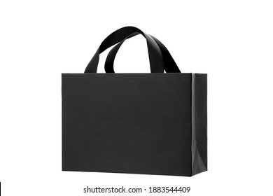 black paper bag from designer paper with ribbon handles, cardboard gift label bag mock up branding festive object isolated on white background, nobody. - Powered by Shutterstock