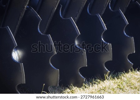 Black part of agricultural disk harrow. Concept of modern technology in agriculture