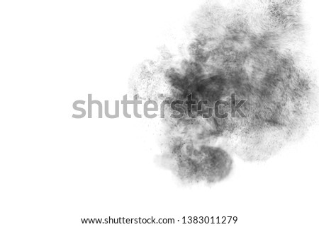 Black particles splatter on white background. Black powder dust burst. 