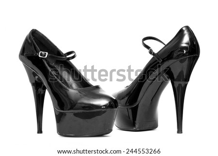 black patent female shoes on a white background