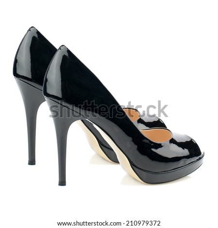 Black patent high heel women shoe isolated on white background.