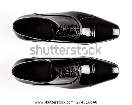 
Black patent leather men shoes against white background
