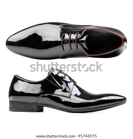 Black patent leather men shoes against white background