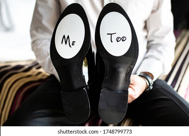 Black Patent Leather Men's Shoes In The Hands Of A Man. The Inscription 