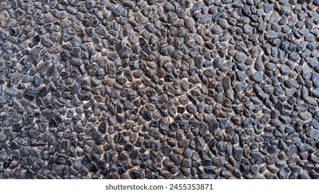 Black pattern of small pebbles
