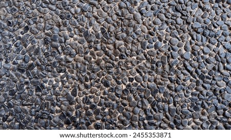 Black pattern of small pebbles