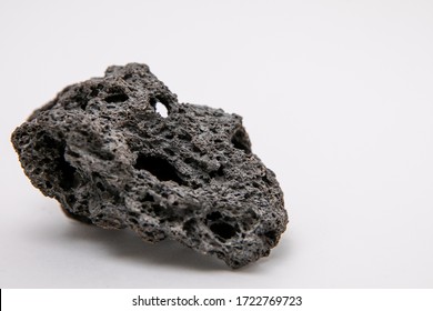 Black patterned stone from the slope of mount Etna, frozen lava