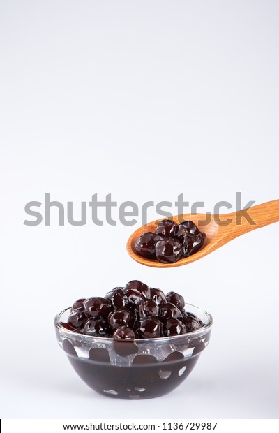 black pearls. Boiled tapioca pearls for\
bubble tea on white background. Copy\
space\
