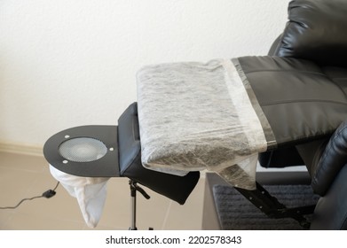 Black Pedicure Chair With Dust Vacuum Cleaner In Beauty Salon. 