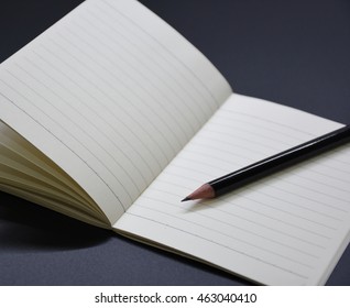 black pencil and note, to do list, reminder.