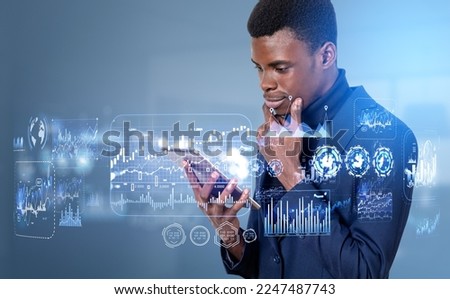 Black pensive businessman with tablet, forex diagrams hud with graphs. Digital business data analysis and research. Concept of online trading