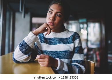 Black Pensive Hipster Girl Thinking About Life While Resting In Cafeteria, Thoughtful Woman Looking Away Feeling Pondering During Free Time In University Campus, African Female Teen In Cafe Interior