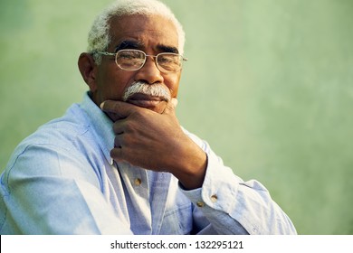 Black people and emotions, portrait of depressed senior man with glasses looking at camera. Copy space - Powered by Shutterstock