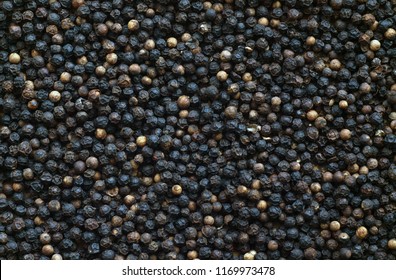 Black pepper close-up with blur effect. Abstract background and texture for design.