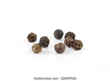 Black Pepper Corns On White Background