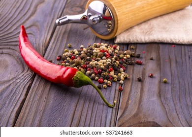 Black pepper corns, red hot chili pepper and Black pepper Powder on wooden background - Powered by Shutterstock