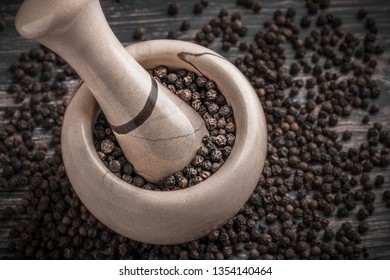 Black Pepper Crushed In Mortar And Pestle Large Overhead Close Up Selective Focus Arrangement On Dark Background Studio Shot