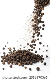 Black pepper fall down isolated white background for your food design.