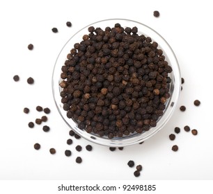 Black Pepper In Glass Bowl On White, Top View