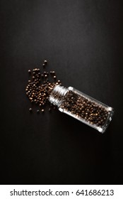 Black Pepper Grinder And Spice On Black Table.