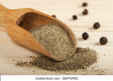 Black Pepper Powder On Wooden Spoon