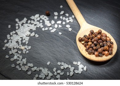 Black Pepper And Salt On Rustic Stone Background. Overhead View Food Photography